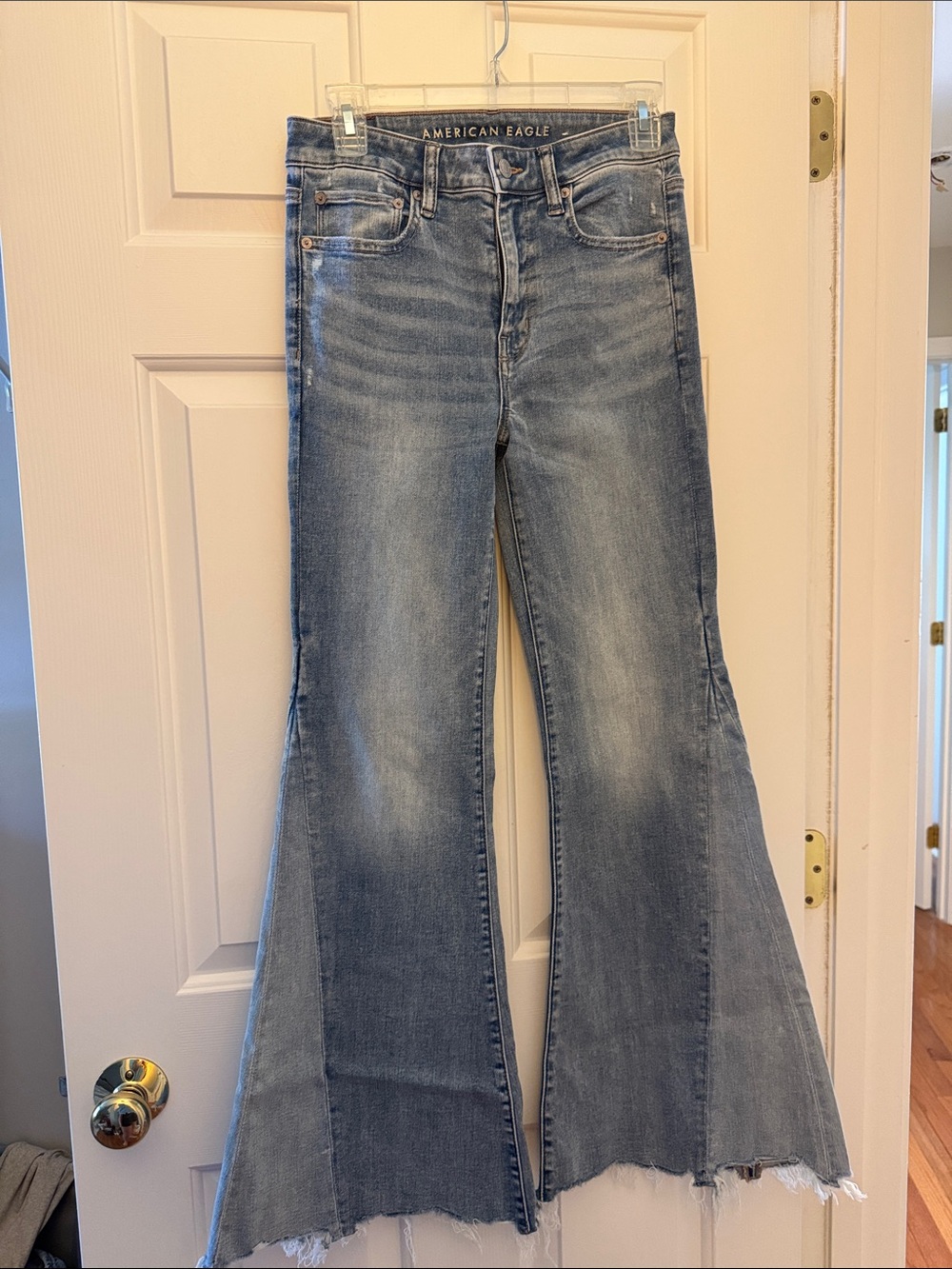 American Eagle Outfitters Light Wash Flare Jeans with Frayed Hem
